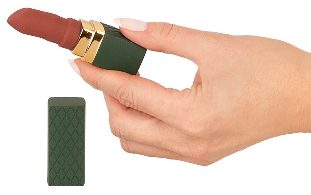 Minivibrator in Lippenstiftform, in Hand gehalten: dunkelgrünes Gehäuse mit rosafarbener Kappe