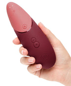 Rosafarbenes Vibrationsgerät mit Handgriff und klar erkennbaren Plus-Minus-Tasten