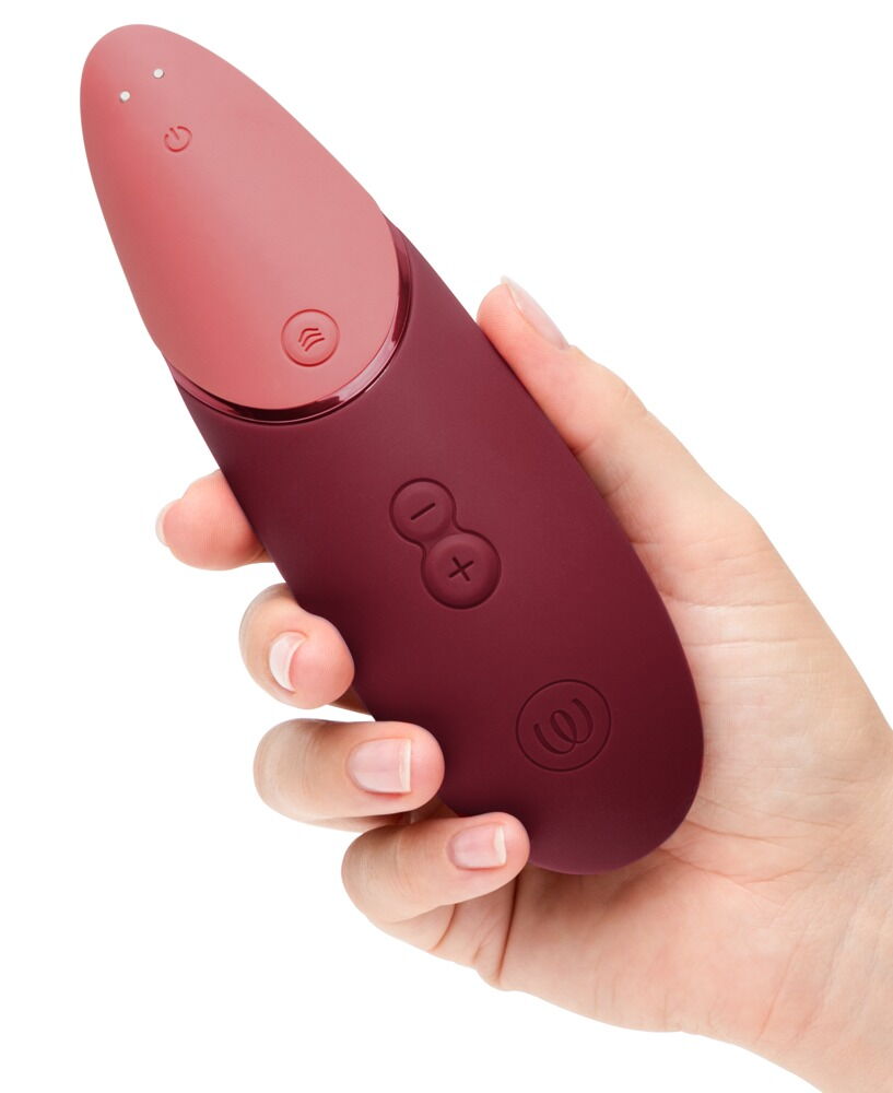 Rosafarbenes Vibrationsgerät mit Handgriff und klar erkennbaren Plus-Minus-Tasten