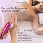 Womanizer PRO Klitorisstimulator, pinkes Handgerät mit weißem Aufsatz
