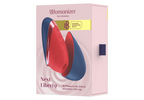 Verpackung Womanizer Next Liberty mit blau- und rotfarbenem Gerät.