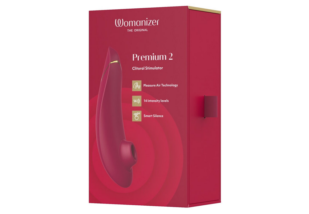 Womanizer Premium 2 Druckwellenstimulator in roter Verpackung mit Produktabbildung