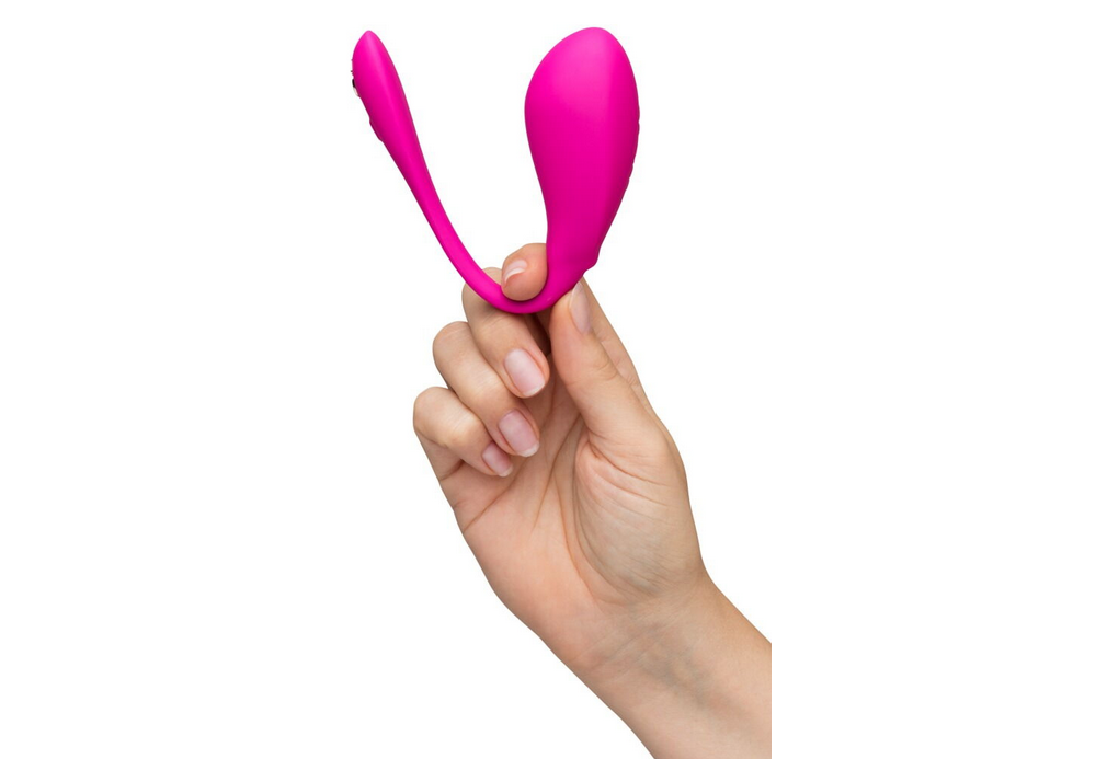 Pinkes ergonomisches Vibro-Ei mit doppelter Spitze, in der Hand gehalten